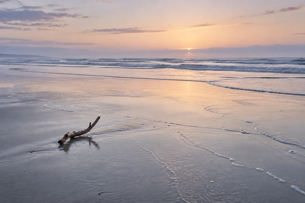 A quiet beach evokes a resolved outro